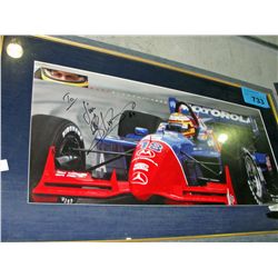 Framed formula1 racing photo, signed by driver