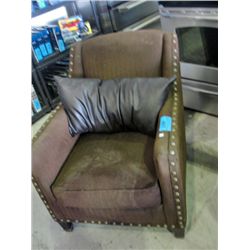 Brown living room arm chair with leather cushion