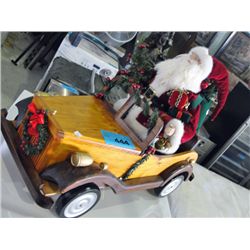 Nicely crafted wooden car with santa claus driver
