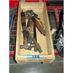 Wooden crate filled with assorted hammers and