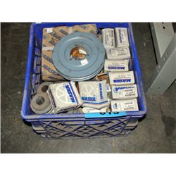 Blue milk crate filled with assortment of pulley