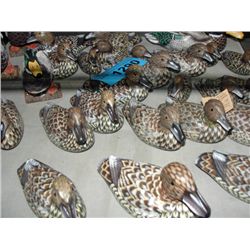 Small shelf lot filled wth hand carved hand