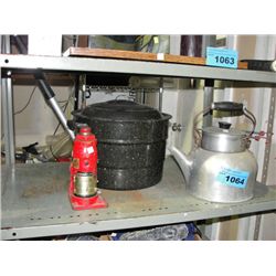 Old aluminum kettle, black cooker, and a bottle