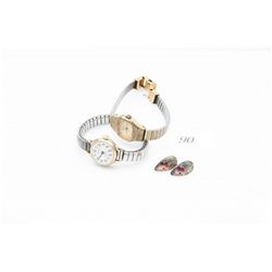 2 ladies wrist watches and a pair of earrings