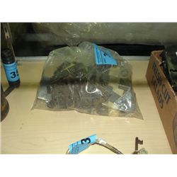 Bag full of small vintage door lock mechanisms