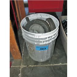 5G pail filled with assorted lawn mower tires