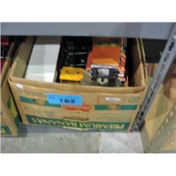 BOx of assorted vintage tin toy trucks