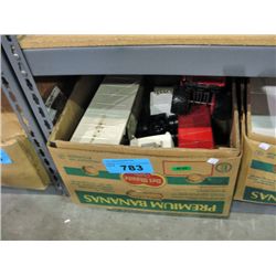 BOx of assorted vintage tin toy trucks