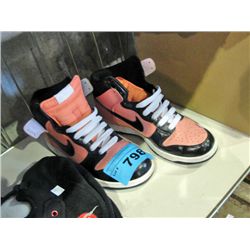 Pair of ladies pink and black hightop shoes