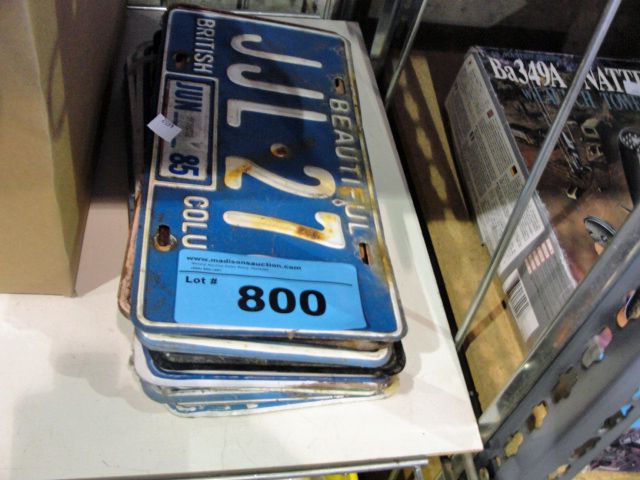 Stack of vintage automobile license plates