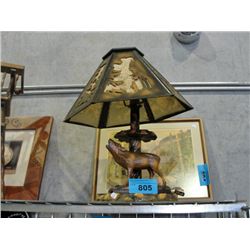 Wood carved moose based table lamp