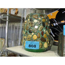 Stone and coin accented art glass vase