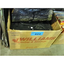 Electric fireplace with decorative logs