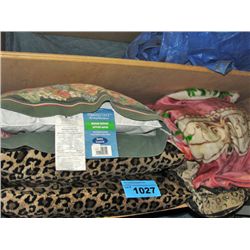 Shelf lot of blankets and pillows