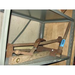 Shelf lot of rustic farm tools