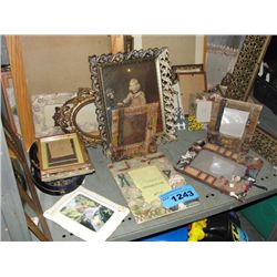 Shelf lot of assorted photo frames, prints and