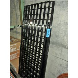 Black store display stand with box of hangers