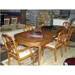 Large walnut finish dining room table with 3 leafs