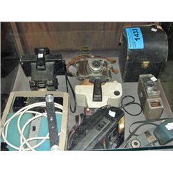 Small showcase filled with assorted vintage camera
