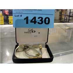 2 ladies wrist watches and a pair of earrings
