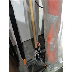 Pole pruner and a garden rake