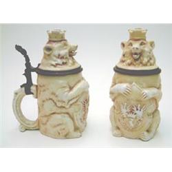 A pair of German commemorative porcelain bear mugs, half litre capacity with pewter mounted cover...