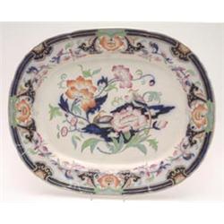 An 'Imperial Stone' china oval meatplate, printed and enamelled with flowering shrubs entitled El...