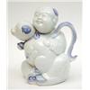 Image 1 : A Fukagawa novelty teapot modelled as a boy holding a dog, 7ins £100-150...