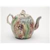Image 1 : An 18th century Whieldon style teapot of ovoid form with tortoiseshell and green trailed glaze an...