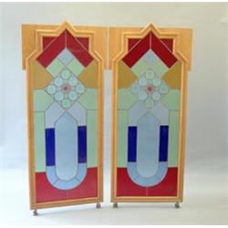 A set of 11 Art Deco satin birch framed sliding doors with geometric multi-coloured leaded glass...