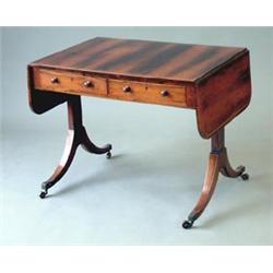 A Regency rosewood sofa table with boxwood strung top, D shaped flaps and two drawers, on end sta...