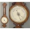 Image 1 : A Victorian rosewood wheel barometer with thermometer, 3ft.4ins. £300-400...