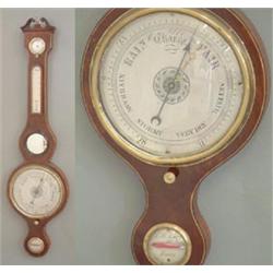 A George III strung mahogany wheel barometer with hygrometer, thermometer, mirror and level, sign...