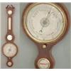 Image 1 : A George III strung mahogany wheel barometer with hygrometer, thermometer, mirror and level, sign...