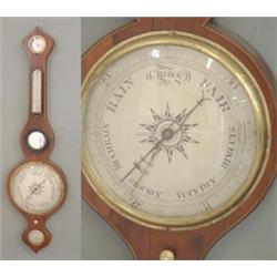 An early Victorian mahogany wheel barometer with boxwood stringing fitted with silvered dials and...
