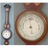 Image 1 : An Edwardian inlaid mahogany wheel barometer by A. Steward, Leicester, broken arch pediment above...