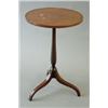 Image 1 : An Edwardian tulipwood strung circular mahogany wine table on baluster stem and tripod downswept...