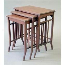 An Edwardian chequer strung mahogany nest of 3 tables with square tapered downswept legs, 1ft.10i...