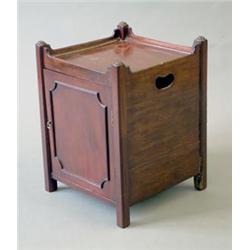 A George III design mahogany bedside cupboard, with tray top over a panelled door on square mould...
