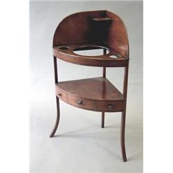 A George III mahogany bowfront 2 tier washstand, the undertier with 1 short and 2 dummy drawers o...