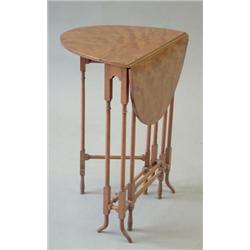 A 20th century satinwood Sutherland table with oval top over slender turned legs, 1ft.4ins. £70-1...