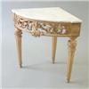 Image 1 : A George II style gilt gesso corner console table, the carrera marble top over pierced scrolling...