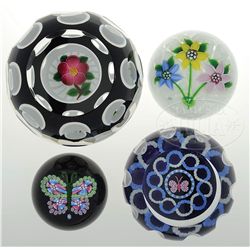 FOUR JOHN DEACONS PAPERWEIGHTS.