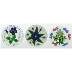 THREE FLORAL PAPERWEIGHTS.