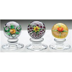 THREE CHARLES KAZIUN PEDESTAL PAPERWEIGHTS.