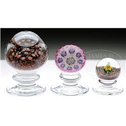 THREE KAZIUN PEDESTAL PAPERWEIGHTS.