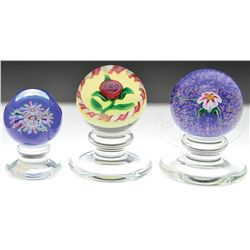 THREE KAZIUN PAPERWEIGHTS.