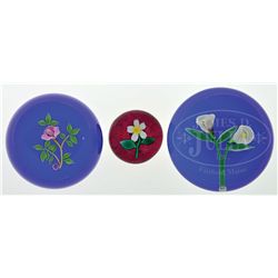 THREE FLORAL PAPERWEIGHTS.