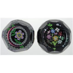 TWO FACETED FLORAL PAPERWEIGHTS.