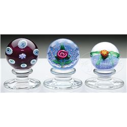 THREE KAZIUN PEDESTAL PAPERWEIGHTS.